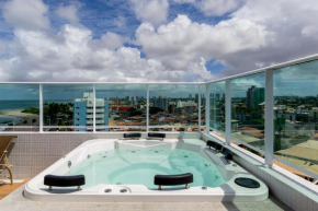 Loft aconchegante, vista mar parcial, vaga privativa